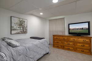 Carpeted bedroom with recessed lighting
