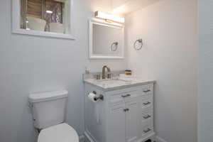 Half bath with toilet and vanity