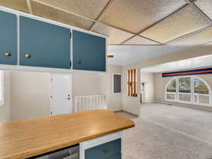 Unfurnished dining area featuring light colored carpet