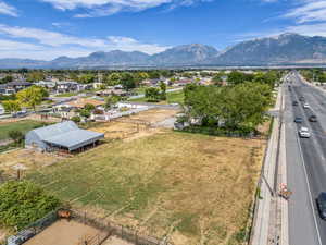 View of mountain backdrop featuring nearby suburban area