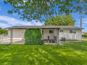 Rear view of property with a patio