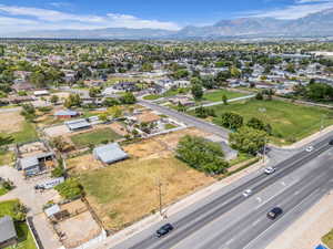 Aerial perspective of suburban area featuring a mountain backdrop