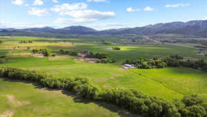 View of mountain background featuring rural landscape