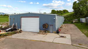 View of outbuilding with a mountain view