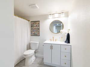 Bathroom with vanity and a shower with curtain