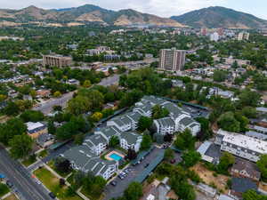 Aerial view of property's location with a mountain backdrop and nearby urban area