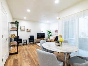 Dining space featuring recessed lighting and light wood finished floors