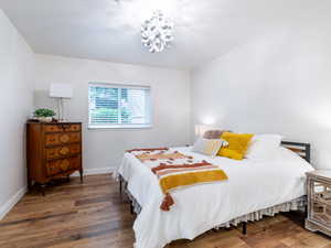 Bedroom with wood finished floors