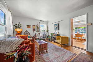 Living area with plenty of natural light and wood finished floors