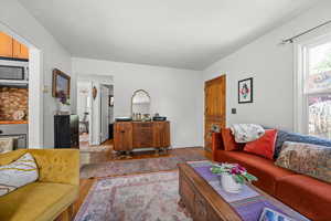 Living area with hardwood / wood-style floors