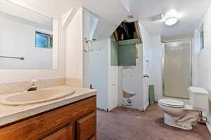 Bathroom featuring a shower stall and vanity