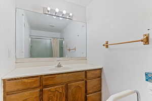 Bathroom with vanity and a shower with curtain