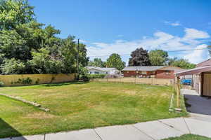 View of yard featuring a carport