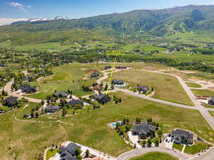 Aerial view of residential area featuring mountains