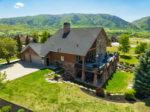 View from above of property with a mountain backdrop