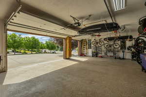 Garage featuring a garage door opener