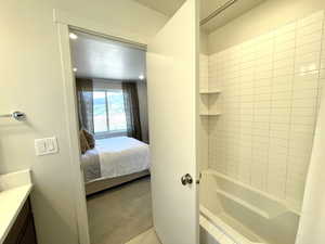 Ensuite bathroom with vanity and  shower combination
