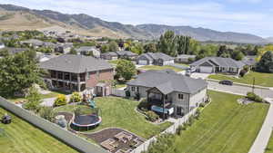 Aerial perspective of suburban area featuring a mountainous background