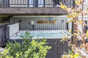 View of patio / terrace with a hot tub