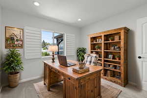 Home office with baseboards and recessed lighting