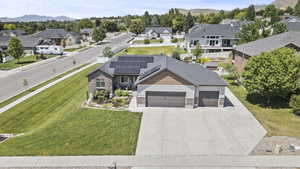 Aerial perspective of suburban area featuring a mountainous background