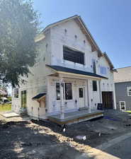 Unfinished property featuring covered porch
