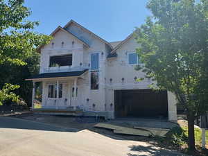 Property in mid-construction with a porch