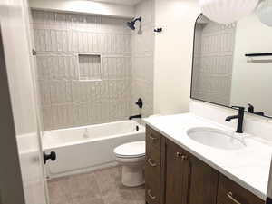Bathroom featuring shower / tub combination and vanity