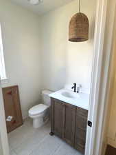 Bathroom with vanity and light tile patterned flooring