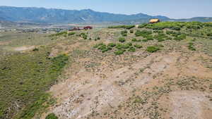 View of mountain backdrop featuring rural landscape