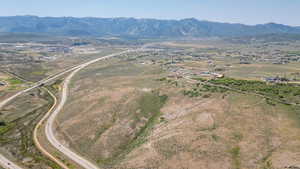 View of property location featuring a mountain backdrop and rural landscape