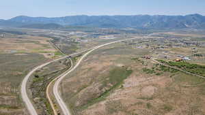 View of property location featuring a mountainous background and rural landscape