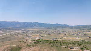 View of mountain background featuring rural landscape