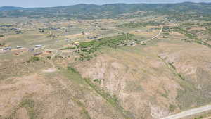 Aerial overview of property's location featuring rural landscape and a mountainous background