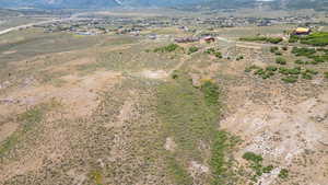 Aerial view of sparsely populated area featuring a mountainous background