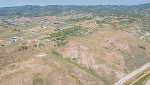 Aerial view of property and surrounding area with rural landscape and mountains