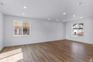 Spare room featuring a smoke detector, wood finished floors, and recessed lighting
