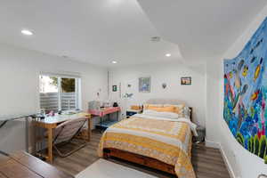 Bedroom featuring wood finished floors and recessed lighting