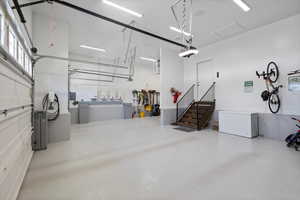 Garage with a garage door opener and fridge