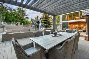 Another view of the outdoor entertainment area looking into the open living room beyond.
