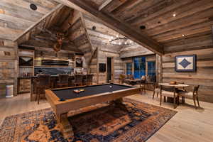 Guest quarters in the 'Speakeasy' style. Two bedrooms, full bath and large common room with five TV's, kitchen, pantry, laundry, and large walk-out deck with fireplace.