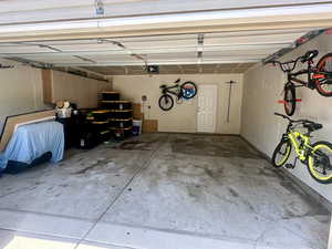Garage featuring a garage door opener