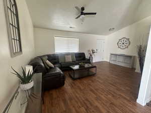 Living area with wood finished floors and ceiling fan