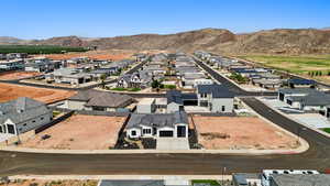 Aerial view of residential area featuring a mountain backdrop