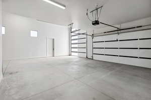 Garage featuring a garage door opener