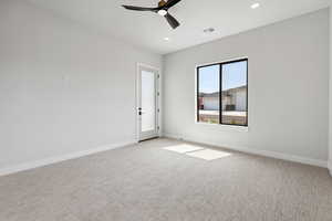 Empty room with ceiling fan, recessed lighting, and light colored carpet