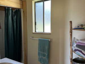 Bathroom with tile patterned floors and vanity