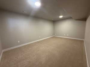 Bonus room featuring carpet floors and baseboards