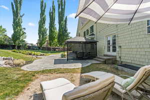 View of patio / terrace featuring french doors, a gazebo, and a playground