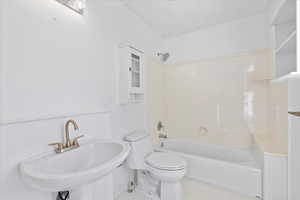 Bathroom featuring tile patterned flooring and bathtub / shower combination